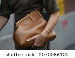 Small photo of Milan, Italy - September 22, 2021: Street style outfit, fashionable woman wearing Fendi clothing and accesories, on the streets of Milan, Italy.