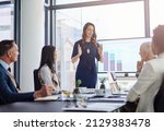 Small photo of Shes taking the lead in this presentation. Cropped shot of a businesswoman giving a presentation in a boardroom.