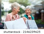 Small photo of I bought so many things today. Cropped shot of a two senior women out on a shopping spree.
