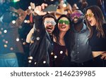 Small photo of Just because we like to party. Cropped shot of a diverse group of young friends taking a selfie together at a party at night.