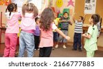 Small photo of Dancing to get rid of all the energy. Preschool students jumping and dancing around having fun.
