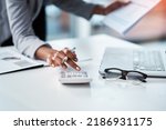 Small photo of Accountant, businesswoman or banker using calculator, checking paperwork and documents while preparing financial data report in an office. Hands of a woman doing payroll or calculating annual tax