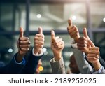 Hands showing thumbs up with business men endorsing, giving approval or saying thank you as a team in the office. Closeup of corporate professionals hand gesturing in the positive or affirmative