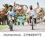 African couple cycling on bike on vacation, peace hand sign on bicycle for sustainable lifestyle in the city and happy on holiday in summer for travel. Eco friendly man and woman in Miami for spring