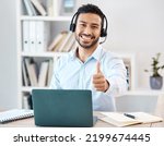 Small photo of Thumbs up, customer service and call center with a man saying yes while working in telemarketing and sales. Motivation, crm and contact us with a male employee saying thank you while consulting