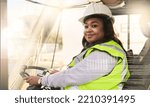Small photo of Forklift driver, black woman and logistics worker in industrial shipping yard, manufacturing industry and transport trade. Portrait of cargo female driving a vehicle showing gender equality at work