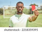 Small photo of Red card, soccer referee and whistle for warning, decision and wrong action, foul or penalty on sports field pitch. Football umpire, black man portrait and judge caution soccer player error with sign