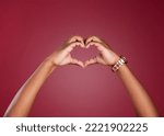 Small photo of Hands, heart and sign for love, care or relationship in romance against a studio background. Hand in hearty emoji, shape or symbol for romantic gesture, valentines day or emotion on copy space