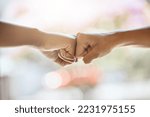 Teamwork, fist bump and motivation, collaboration and success for goals, trust and support. Closeup friends, greeting hands and team building, commitment and winner, solidarity and fighting racism