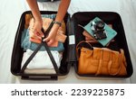Small photo of Travel suitcase, bedroom and hands of woman packing for Europe holiday, vacation or adventure tourist journey. Hospitality, hotel bed and photographer with luggage bag, clothes and camera in Madrid