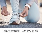 Woman, hands and shoelace for street runner, outdoor workout and fitness in summer sunshine in morning. Running adventure, shoes and tie lace for safety, speed and balance in road exercise for health