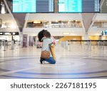 Small photo of Mother hug child at airport for travel journey, welcome home reunion or goodbye, immigration and international opportunity. Black family mom and girl or kid hugging and sad for flight voyage in lobby