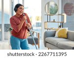 Small photo of Singing, cleaning and headphones of a woman with music working in a home dancing with happiness. Spring cleaning, cleaner and happy person sing and dance with a mop in living room listening to audio