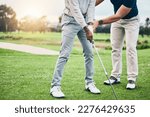 Small photo of Golf lesson, sports teaching and coach hands helping a man with swing and stroke outdoor. Lens flare, green course and club support of a athlete ready for exercise, fitness and training for a game