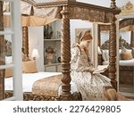 Small photo of Bedchamber solitude. an elegant noble woman reading in her palace room.