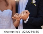 Wedding, rings and closeup of a couple with a pinky promise for love, loyalty and marriage. Romance, hands and married man and woman with jewellery for their union and bond at a romantic event.