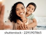 Small photo of Smile, selfie and mother with child on a bed hug, love and bonding in their home together. Portrait, embrace or woman with son in bedroom waking up, happy and posing for profile picture, photo or pov