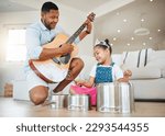 Small photo of Family knows your flaws but loves you, anyway. Shot of a father and daughter playing music at home.