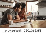 Small photo of Laptop, couple and financial planning in a kitchen with documents for budget, savings and paying bills. Interracial, online and people with paperwork for taxes, mortgage and home loan application