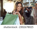 Small photo of Portrait, woman and shopping bags in store for fashion, sale or discount deal and fun. Face of female person or happy customer with retail bag for shop promotion offer, designer clothes at a boutique