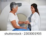 Small photo of Doctor, ct scan and woman holding hands of patient in hospital before scanning in machine. Mri, comfort and happy medical professional with senior female person before radiology test for healthcare.