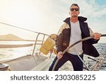 Water adventure, rich man sailing on a yacht and retirement on sea with in blue sky. Travel or freedom, sunshine or relax and mature male on summer vacation or holiday break on cruise boat.