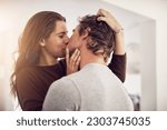Small photo of Face of happy woman, man and kiss with love in apartment for romance, intimacy and special moment together. Young couple kissing in home for romantic relationship, happiness and passionate partner