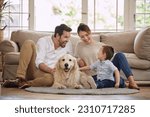 Small photo of Family laugh, home and dog with child, mom and dad in living room with love in lounge. Animal, pet and mother with father and young kid with happiness in house with golden retriever and care on floor
