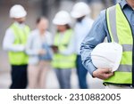 Businessman, architect and helmet for safety in construction, project management or meeting on site. Man holding hard hat for industrial architecture, teamwork or maintenance and building in the city