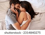 Small photo of Smile, bedroom hug and happy couple laughing at funny joke, relationship humour or home comedy in Spain. Marriage happiness, love bond and top view of relax man, woman or morning people laugh in bed