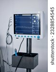Small photo of Medical monitor, heart machine and healthcare, cardiology and equipment with stats and vitals in hospital. Medicine, health information and wellness, digital and screen with EKG and ECG in clinic