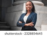 Arms crossed, lawyer or portrait of happy black woman with smile or confidence working in a law firm. Confidence, empowerment or proud African attorney with leadership or vision for legal agency