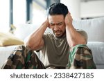 Small photo of Soldier, man and stress, headache or PTSD of military trauma, remember pain and fear or scared on floor. Sad, frustrated and mental health of army or veteran person with depression or anxiety at home