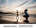 Kid is running to mom, beach and silhouette, family with games and love, travel and freedom together outdoor. People, sunset and adventure, woman and girl bonding on tropical holiday and nature