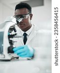 Small photo of Microscope, black man and analytics with research, medical and experiment for vaccine, test or sample. African person, scientist or researcher with lab equipment, pathology or biotechnology with cure