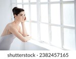 Woman, ballet dancer and thinking at window for future creative, artistic vision or passion goals. Female person, elegant costume and idea thoughts for hair bun dreaming, career or performance plan