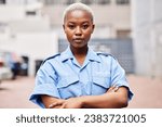Small photo of Portrait, black woman and security guard with arms crossed for surveillance service, safety and urban watch. Law enforcement, bodyguard or serious female police officer in blue shirt for city patrol