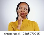Small photo of Thinking, guess and black woman in a studio with memory, brainstorming and planning facial expression. Guess, question and young African female model with a confused face isolated by gray background.