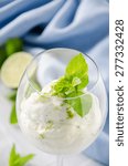 Small photo of Mint, lime and lemon syllabub in a glass