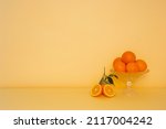 Oranges in a glass bowl. an...