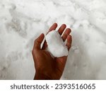 Small photo of snow white chemical fertilizer hands on background. ammonium sulfate fertilizer is hygroscopic. Ammonium sulfate fertilizer functions to increase the nutritional value of plants.