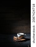 Small photo of A cup of black coffee on negatif space photography composition with wooden background