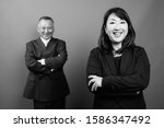 mature asian businessman and... | Shutterstock . vector #1586347492