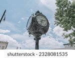 Small photo of Montgomery, Alabama USA - July 5, 2023: Historical town clock advertising Klein and Son Jewelers prominently displayed on Dexter Avenue