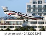 Small photo of St. Maarten, Netherlands Antilles - Jan 15 2024: A St Barth Executive Pilatus PC-12 turboprop commuter plane, landing at the SXM Airport