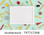 Back to school. School creative desk. Blank frame top view and stationery ruller, pen, paper plane, scissors. Flat lay.