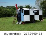 Small photo of Dudley, West Midlands-united kingdom July 13 2019 WW2 Runway Control Caravan, with airman entering