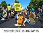 Small photo of The Hague,The Netherlands,27th may 2023.Thousands of Extinction rebellion activists protesting by blocking the A12 motorway. The police used watercannons to end the demonstration.