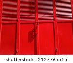 The shop door is bright red, very bright like a ferrari red, Defocused abstract background