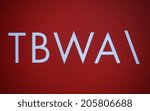 Small photo of CIRCA MAY 2014 - BERLIN: the logo of the brand "TBWA".